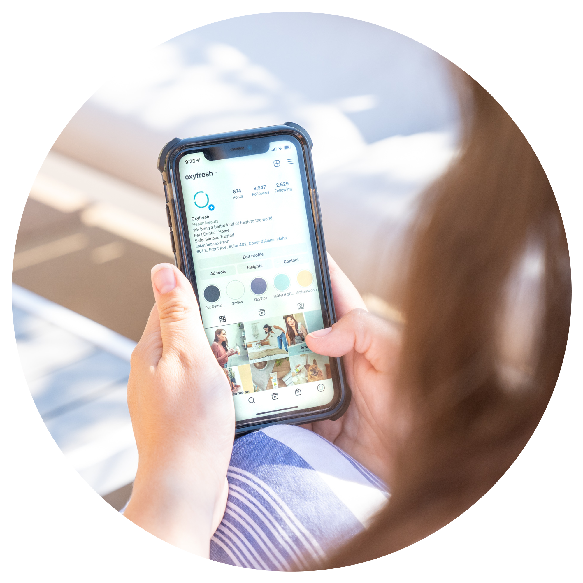 over-shoulder image of a person following oxyfresh on social media