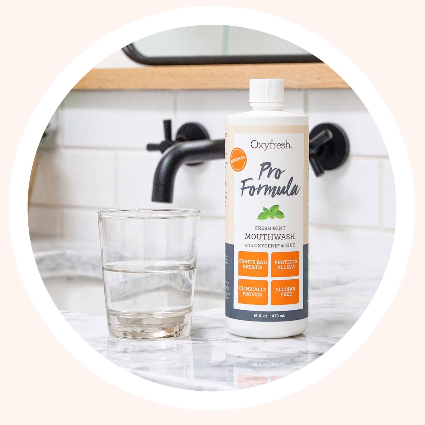 Oxyfresh-pro-formula-toothpaste_oxyfresh-pro-formula-zinc-mouthwash-sitting-on-counter-next-to-glass