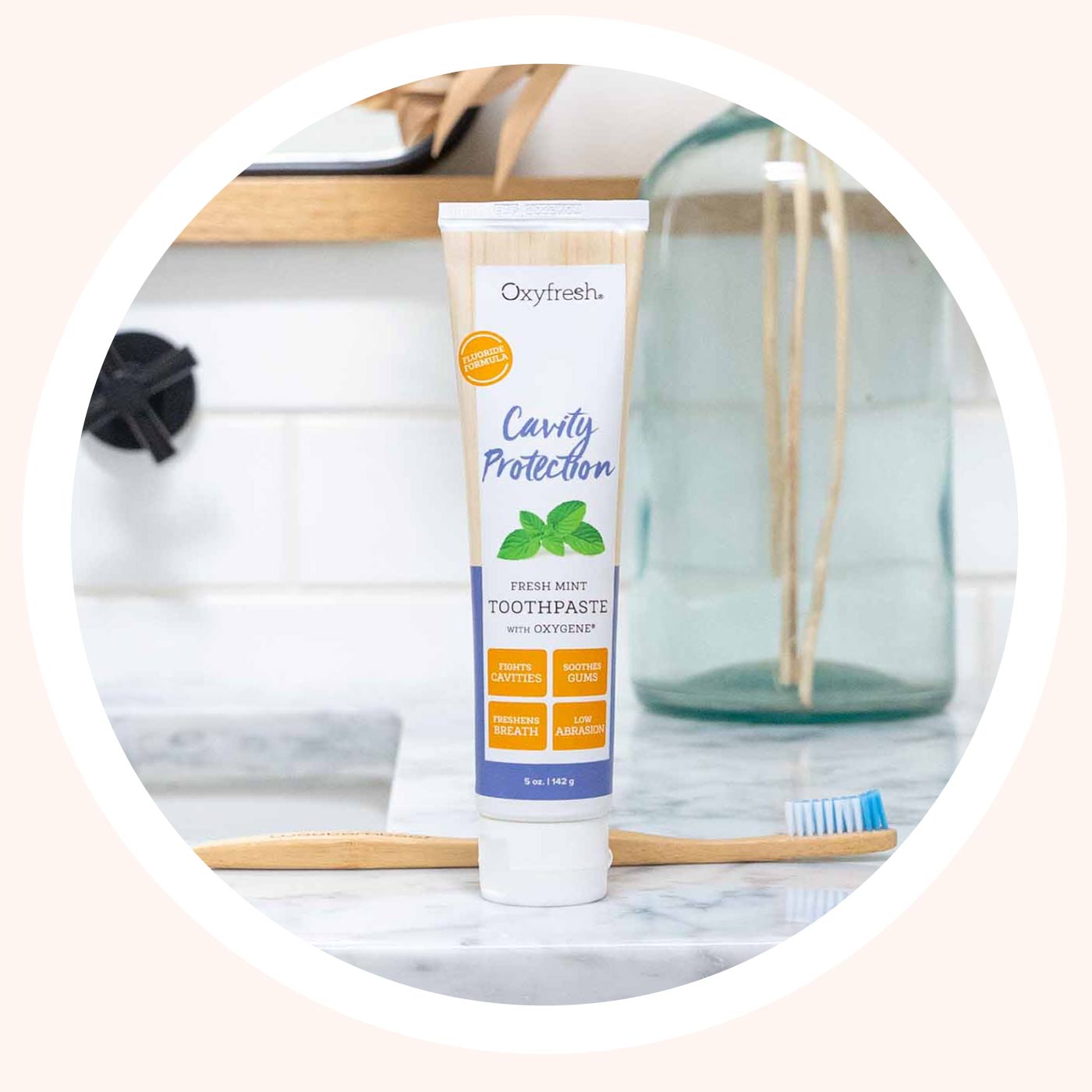 oxyfresh-cavity-toothpaste-on-counter-in-front-of-toothbrush