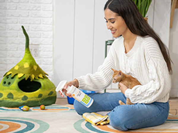 woman-holding-adorable-orange-kitten-and-using-oxyfresh-stain-and-odor-remover-as-cat-pee-deterrent