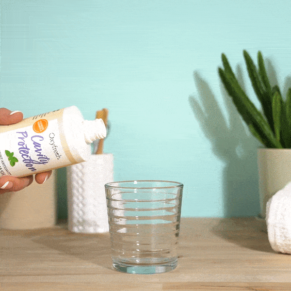 oxyfresh-cavity-protection-mouthwash-with-fluoride-pouring-into-glass